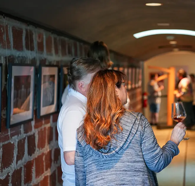 People viewing art in the Rex Hill tunnels.