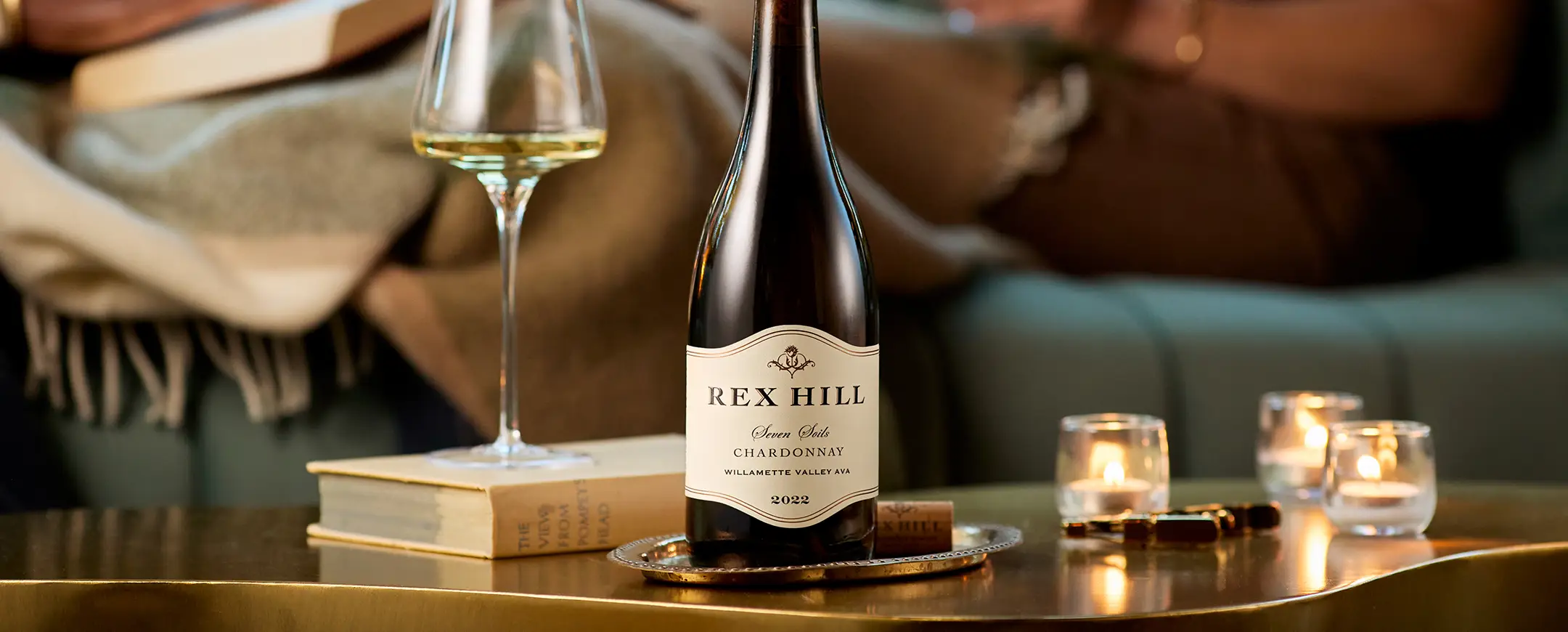 Rex Hill Crown Club wines on a table with tea lights.